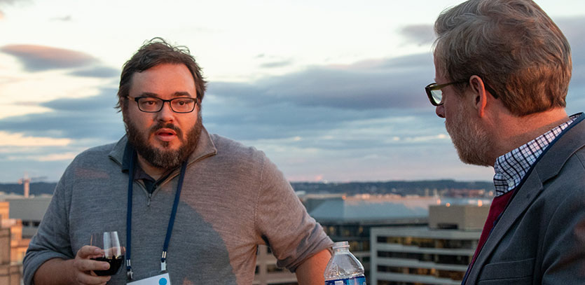 Workshop participants gather following a presentation.